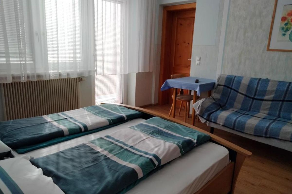 Airbnb apartment bedroom with twin beds — original photo