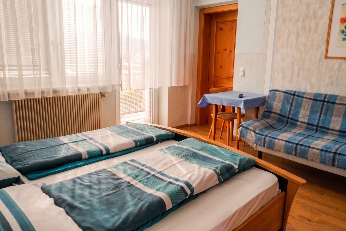 Airbnb apartment bedroom with twin beds — after enhancement